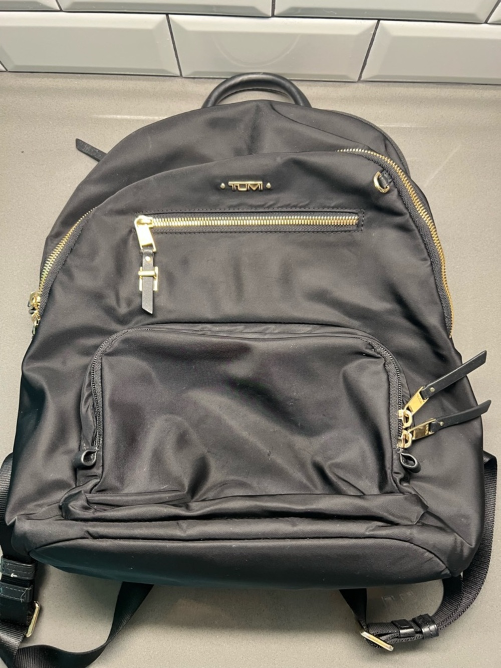 Tumi Black Backpack with Gold Hardware